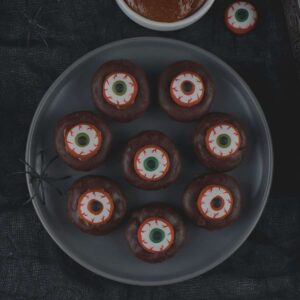 Plate of min eyeball donuts for Halloween.