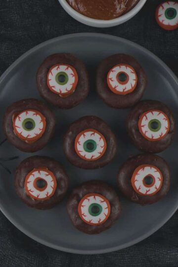 Plate of min eyeball donuts for Halloween.